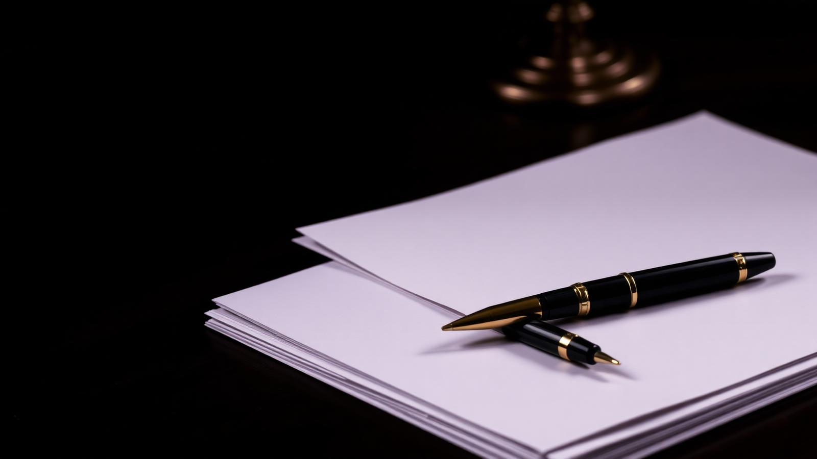 Legal documents and pen on a desk